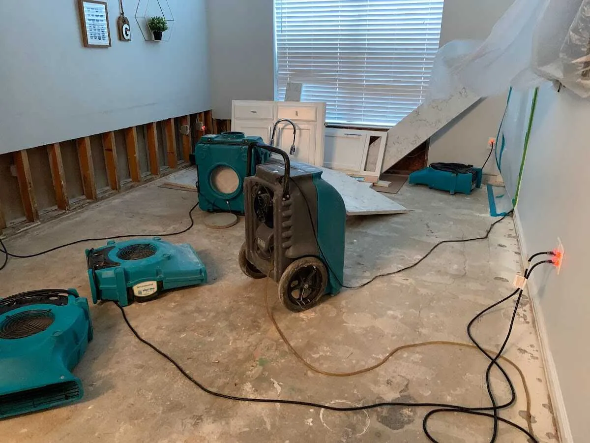 Dehumidifier in flood-cut room for Water Damage Restoration in St. Anthony